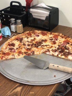 XL Meat Lover's pizza. Almost as big as the table!