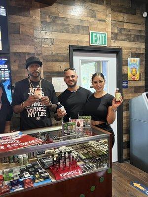 Musician from bone thugs and harmony and the owners of the cannabis shop Greg and Yvette during a patient appreciation.