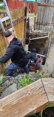 Two Ready Rooter technicians at a customer in Seattle hydrojetting a mainline.