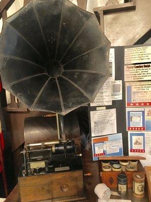 Phonograph with music on wax rolls and the socks (put a sock in it!)