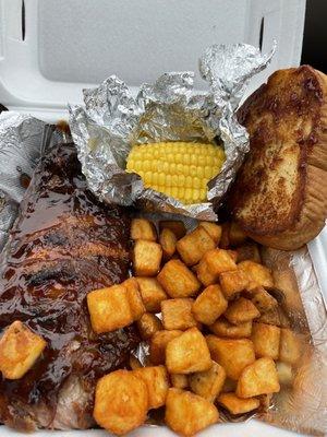 Fries, ribs, corn and garlic bread.