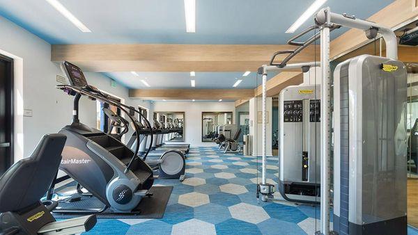 Apartment community 24-hour fitness center at Griffis South Bay in Milpitas, California.