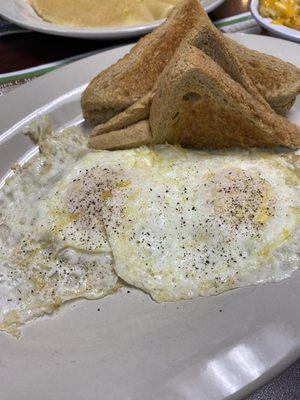 Eggs over medium with wheat toast