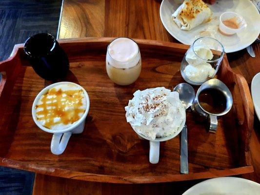 Cold brew, iced coffee with strawberry cold foam, affogatto,  caramel macchiato,  and mocha latte.