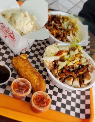 Chicken bowls, potato salad and a bull dog.