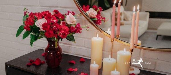 Red wildflower bouquet and a variety of candles