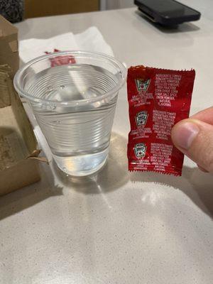 Cup of water I ordered, which was the size of a ketchup packet... did I order a kids meal?