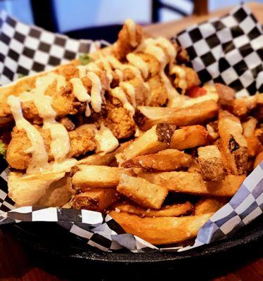 Cod fish po' boy covered in spicy aoli and a side of fries, $12.95