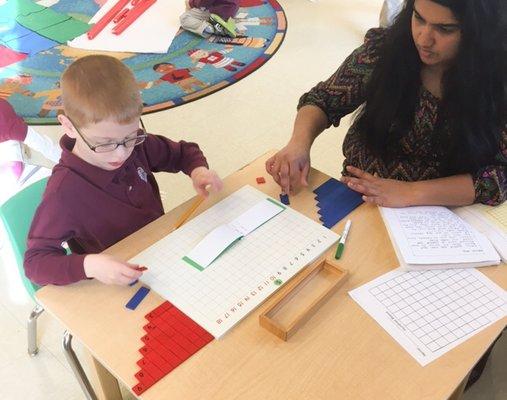 Montessori provides one-on-one lessons for each student. In this lesson, the student is working on the Addition Board.