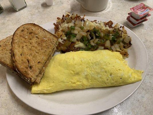 Corned Beef Hash and cheddar omelette , loaded hash browns with multi grain toast!! Amazing homemade hash!! Top notch!!