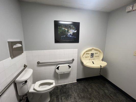 Changing table in the restroom very clean.