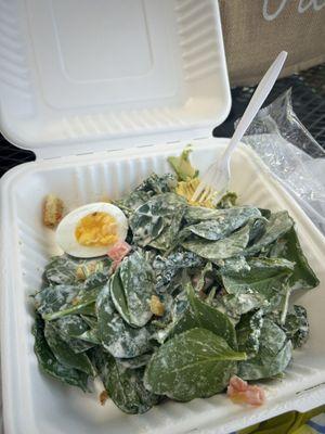 Soggy spinach with half yes HALF an egg and a bite of avocado. That's how it arrived for $13.68