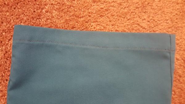 Left leg of pants. Came in to get them hemmed. Look at the uneven stitching