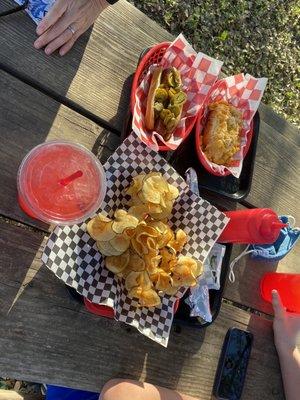 corn dog, hotdog with jalapeños, curly fries, and strawberry lemonade