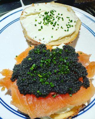 Bougie garlic bagels with cream cheese, lox, caviar and chives