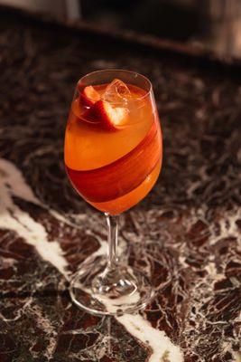 Aperol Spritz | Aperol, Prosecco, Strawberry,
Orange, Rhubarb, Soda