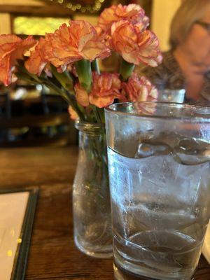 Water and flowers on the table