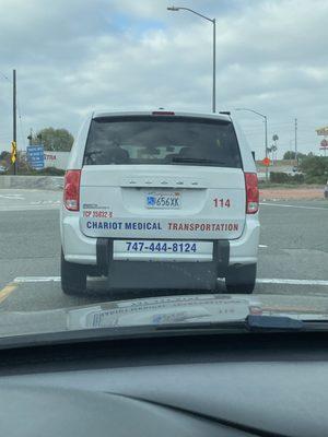 Photo of the vehicle being driven by a driver smoking cigarettes.