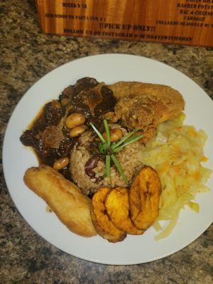 Oxtail, fried chicken, rice and peas, cabbage plantain festival