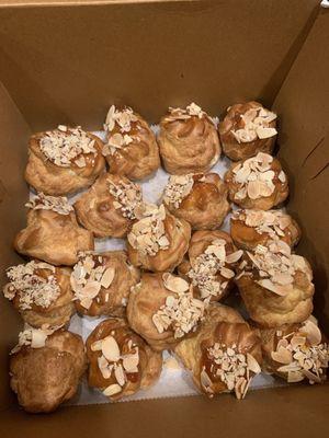 Custard puffs with caramel and shaved almonds