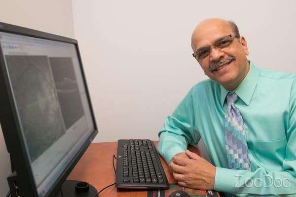 Dr. Ramachandran, O.D., diligently working