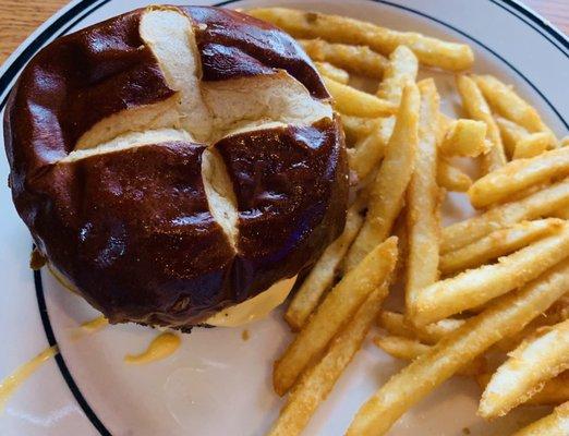 Beer Cheese and Pretzel Bun Burger with a side of Crispy Fries