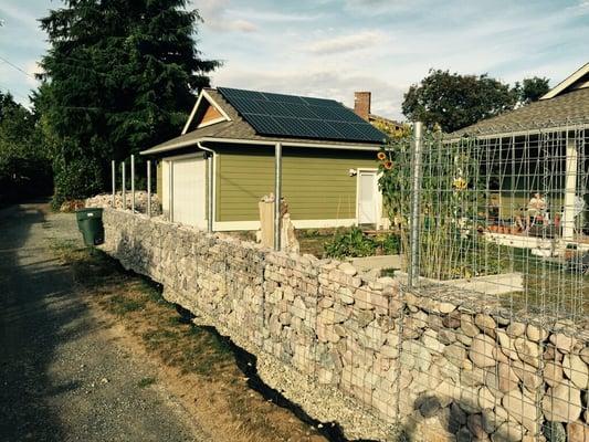 Marc & Karen's gabion Montana River Rock 'fence' going up.  Bellingham, 2015.