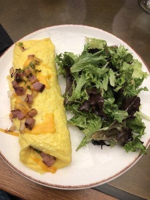 Denver omelette with side of greens.