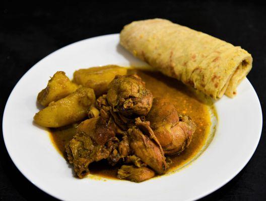 Chicken curry with potato with dhal puri on the side