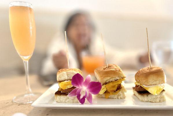 P.O.G. mimosa and Brunch Sliders (vegan Omnipork, scrambled egg, cheddar on a sweet Hawaiian roll)