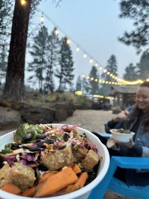 Eating our takeout food by the fire pit outside our room