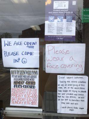 The signs explaining the importance of wearing masks inside the bakery