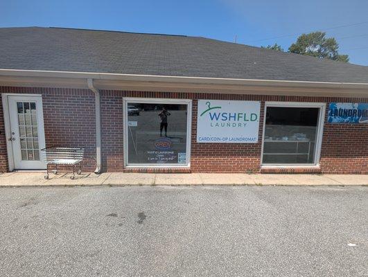 You know you are here when you see the WshFld signs. 3721 Macon Rd Laundromat front entrance