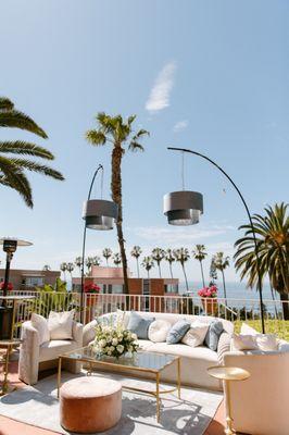 Pastel pink + blue wedding lounge along the Pacific Coast