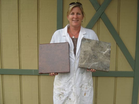 Here's me, holding two Aurastone samples I made in class.