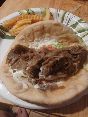 The gyro with lettuce,  tomatoes,  onns, and sauce. Pita bread is super fresh.