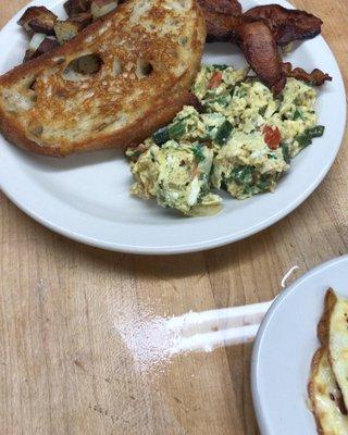 SOTB eggs, home-fried red potatoes in butter and EVOO with bacon and house-made Sourdough toast.