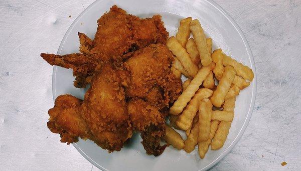 Fried chicken wings with French fries