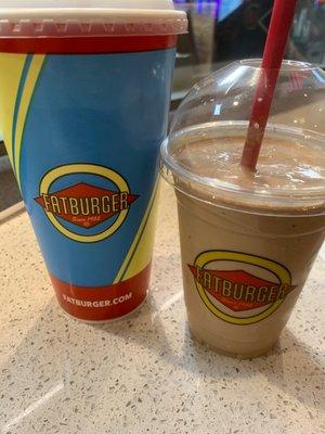 Large Dr Pepper on the left and a chocolate shake on the right.