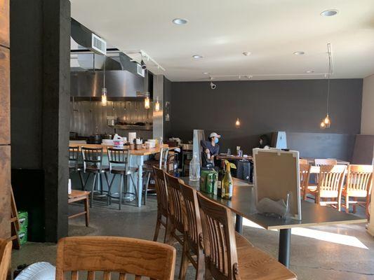 Casual eatery with a handful of tables and seating at the bar.