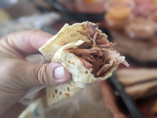 Smoked carnitas in a homemade tortilla with a secret ingredient.