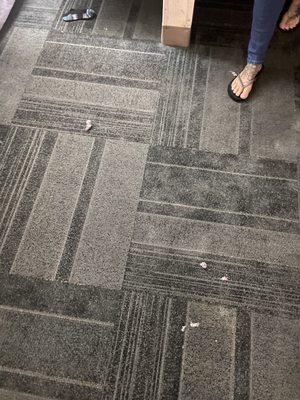 Someone's random sock and trash all over the floor