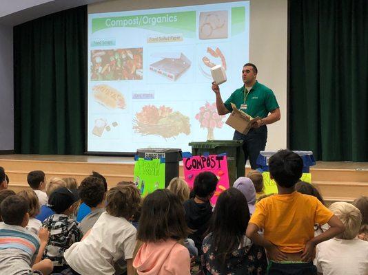 Tim Elias teaching our K-5 students to divert organics and recyclables from the landfill.