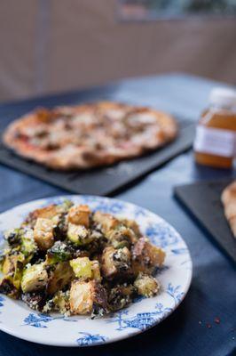 Roasted brussels Caesar, Castelvetrano olives, focaccia croutons at Serious Pie - Downtown Seattle location