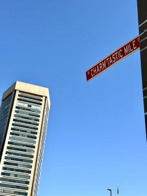 The World Trade Center in the background of the Iconic "Charm'tastic Mile" Street Sign