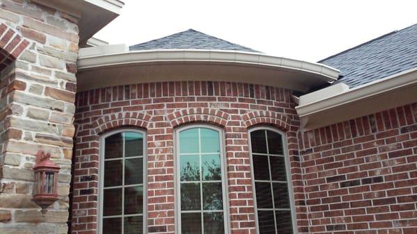 Here is a picture of a recent radius gutter installation.