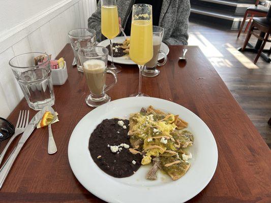 Chilaquiles Verde with an orange mimosa and latte