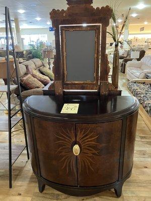 Unique cabinet with mirror.