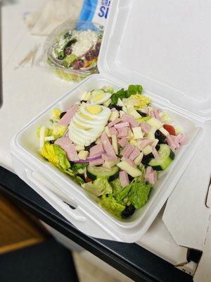 Chef salad with ham, eggs, and olives