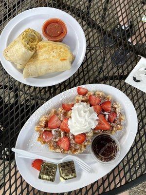 Burrito and waffles with strawberries